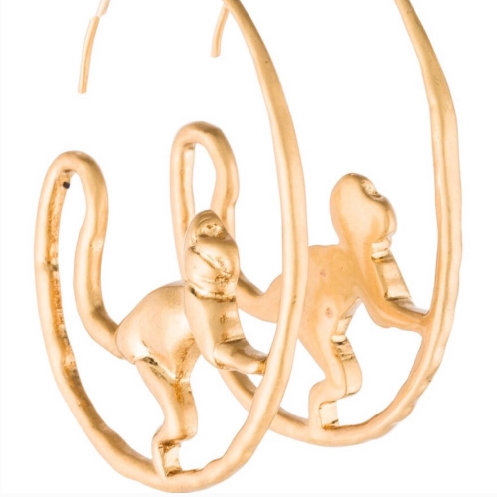 Pair of gold Tory Burch monkey hoop earrings.